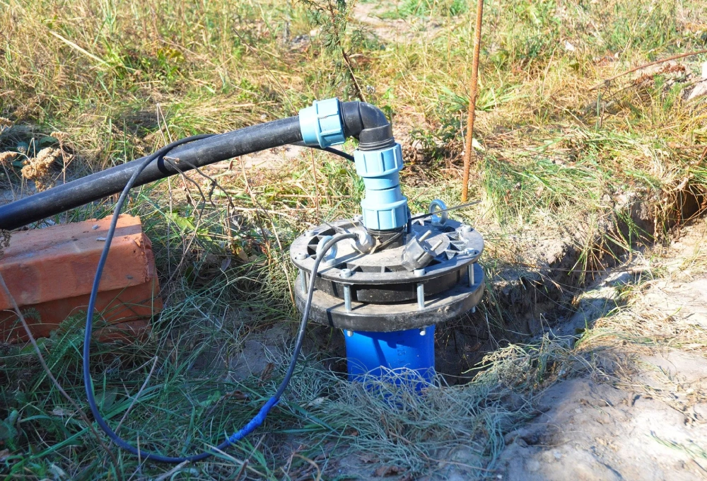 A blue pipe is connected to the ground.